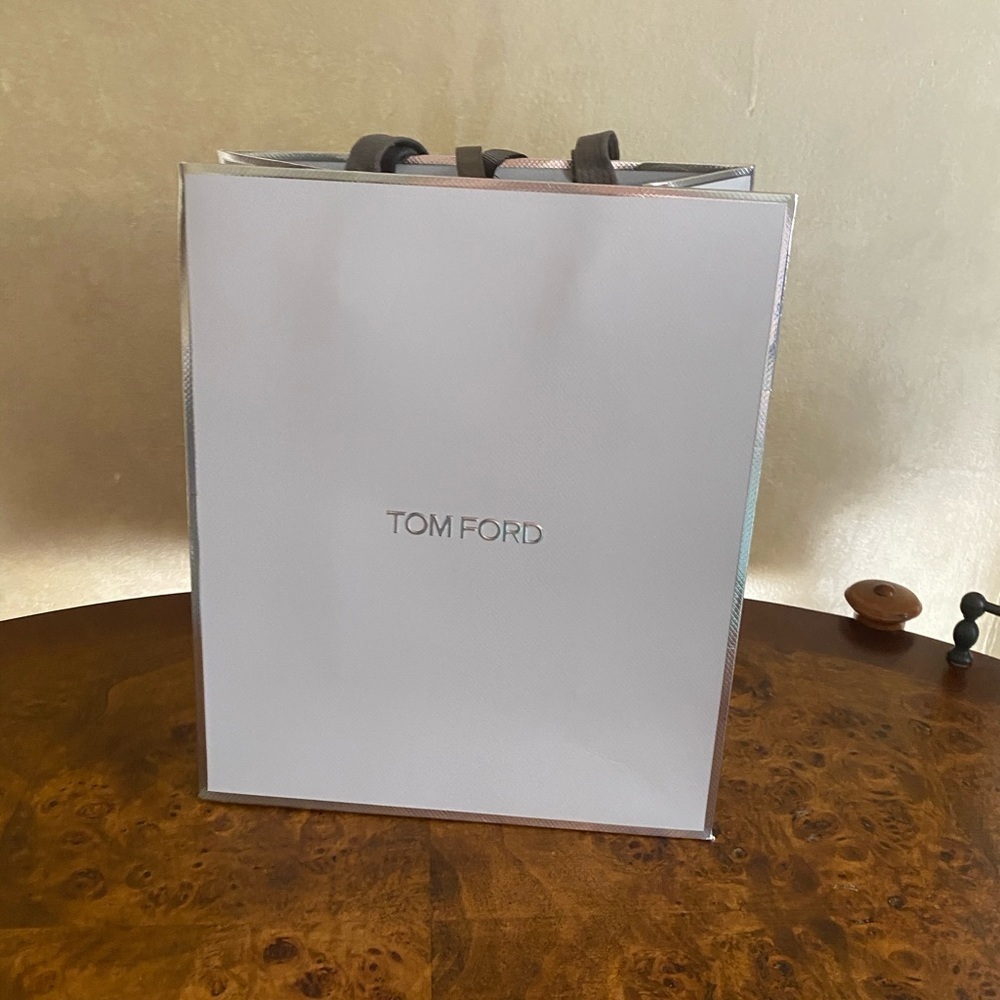 Tom Ford grey and silver paper gift bag.